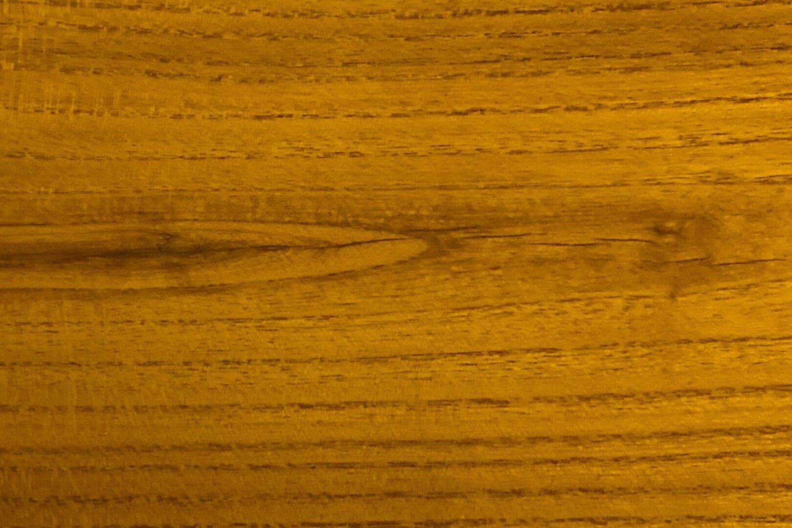 Golden-brown wood with distinct grain lines.